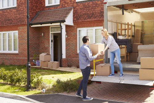 Flat removals team handling apartment furniture in Edgware