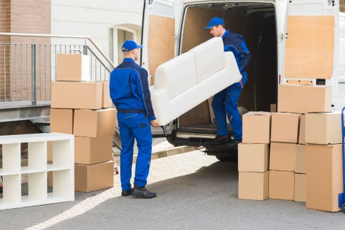 Edgware Movers team sorting recyclable packing materials during a sustainable house move