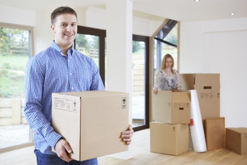 Careful loading of household items into a moving van in Edgware
