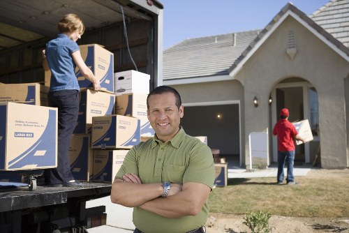 Moving team handling boxes and furniture near Edgware homes