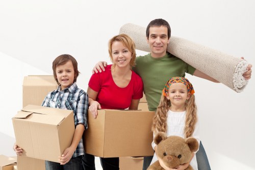 Furniture and boxes being loaded into a moving van in North West London