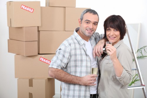 Loading boxes and household items into a van in Edgware